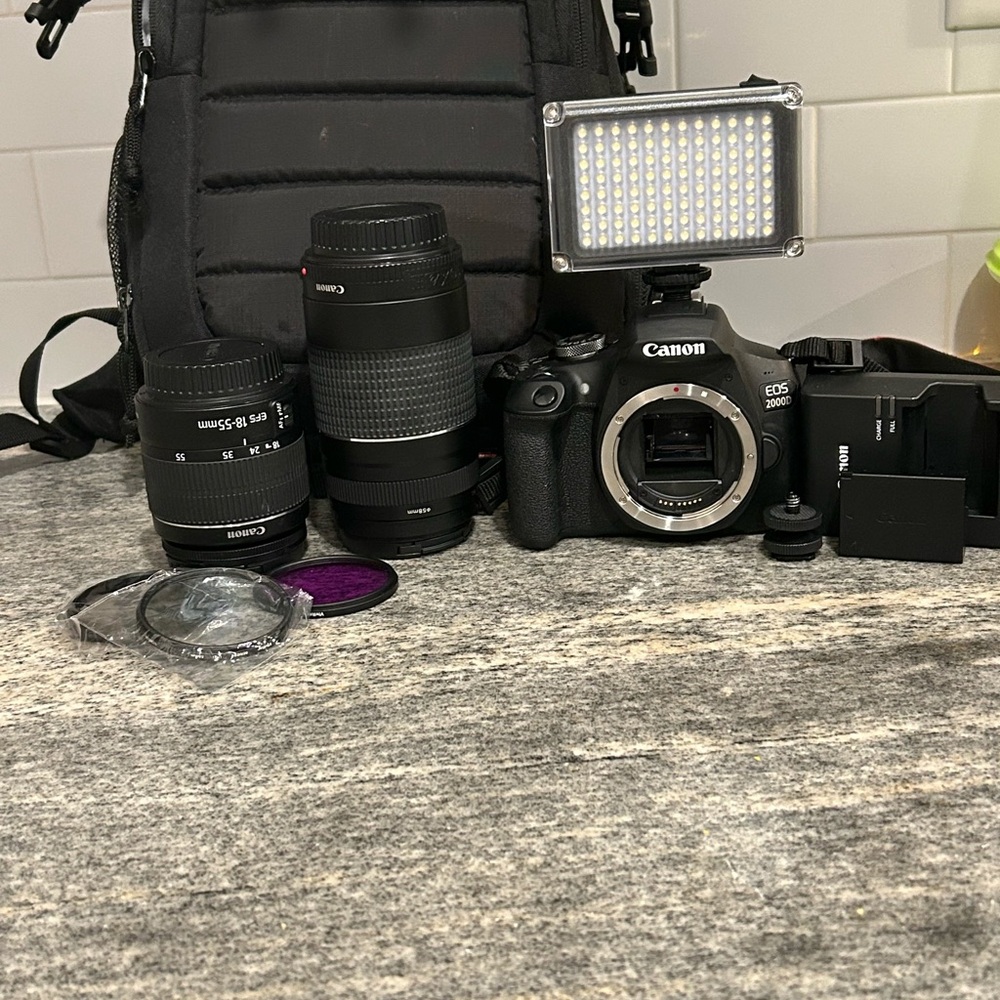 Canon Black Digital Camera with Multiple Lenses and LED Light